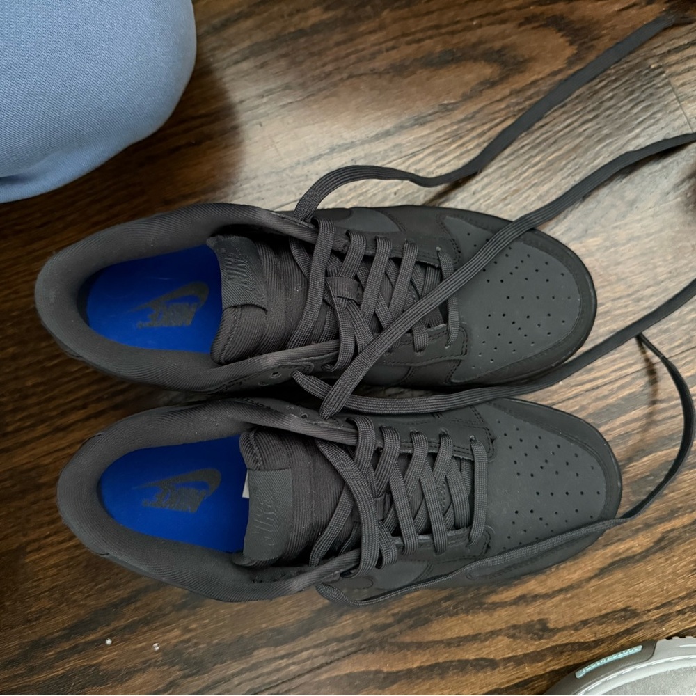 Nike Black Sneakers with Low Top Design and Bright Blue Accents